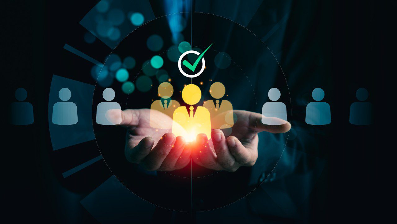 Hands holding a glowing icon representing team leadership and approval.
