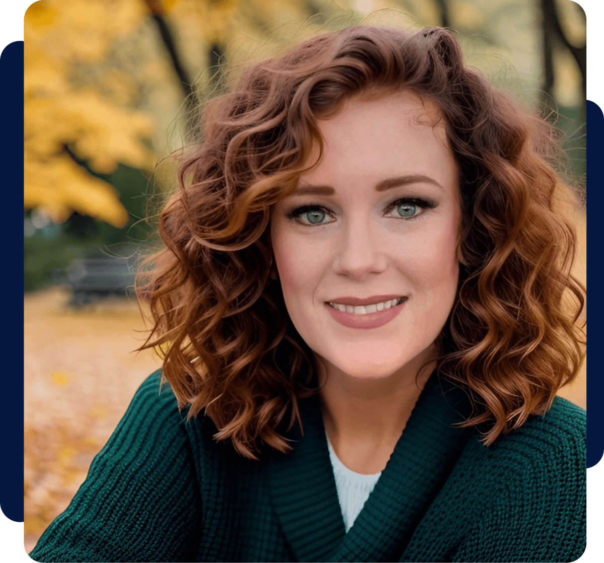 Smiling woman outdoors with autumn background.